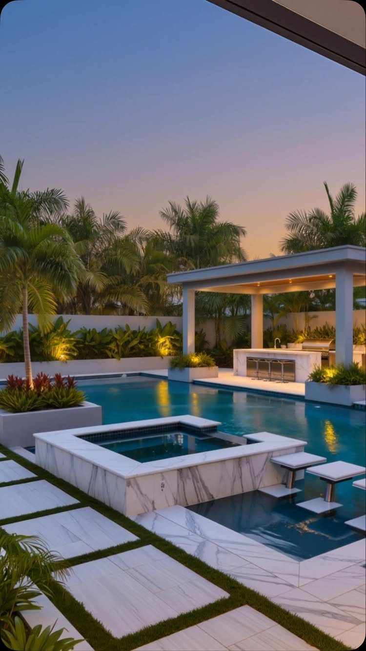 A luxury swimming pool with a marble hot tub and a covered outdoor kitchen area.