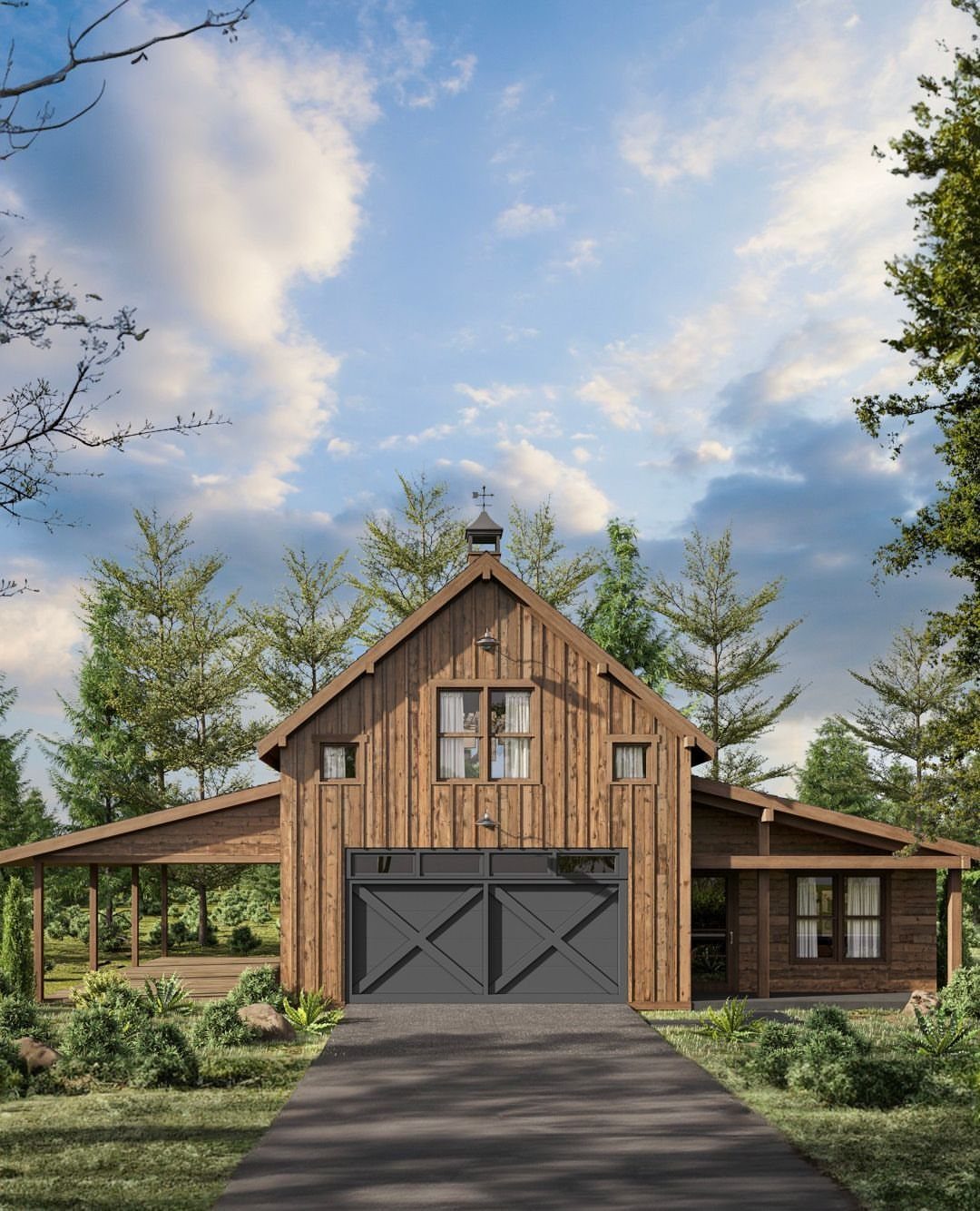 Wooden barn-style garage with windows on the second floor and a large grey door below.