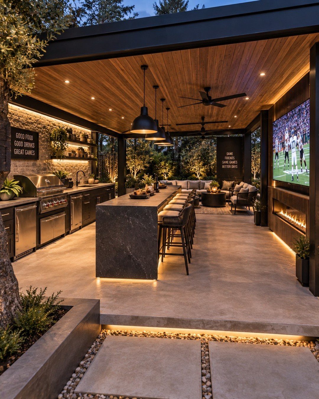 A modern linear outdoor kitchen with a dark stone island, built-in grill, and wooden ceiling.