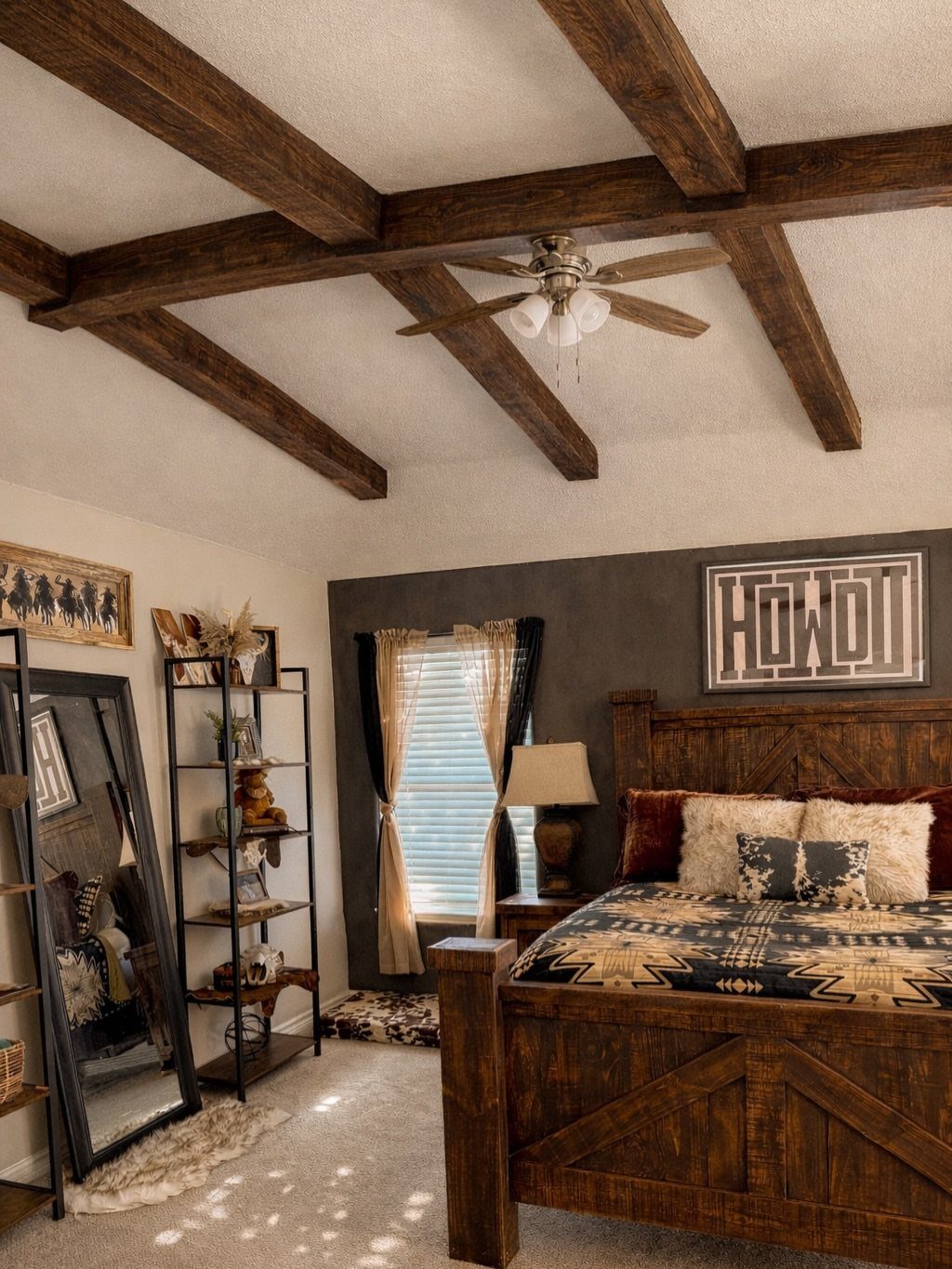 Rustic brown bedroom with wooden ceiling beams, dark grey wall, and wooden bed frame.