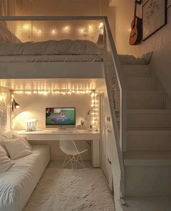 White teen loft bedroom with raised bed, desk area, and white stairs.